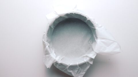 6-inch cake pan lined with parchment paper for making Basque Cheesecake.