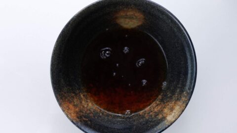 Udon broth in a serving bowl.