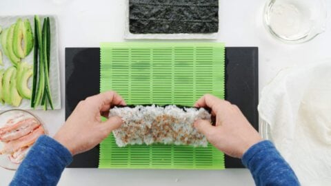 Flipping sushi rice over.