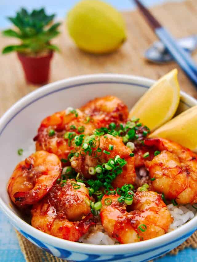 Easy shrimp rice bowl with plump juicy shrimp glazed with a decadent garlic butter-soy sauce on a bed of rice.
