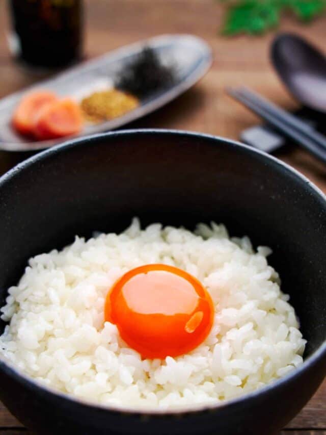 Tamago Kake Gohan is a popular Japanese breakfast food and this on features a vibrant orange egg yolk over a bed of piping hot rice