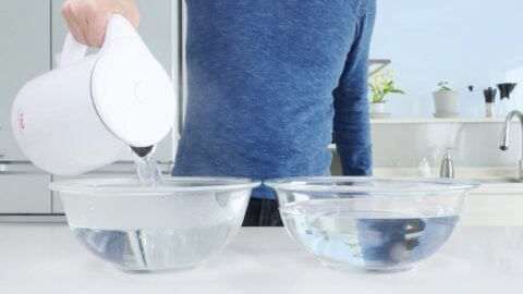 Preparing a bowl of hot water and cold water to blanch the wagyu.