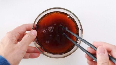 Making gyudon sauce in a glass bowl.