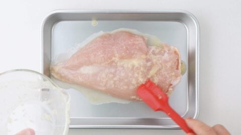 Marinating chicken breast for teriyaki.