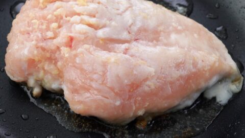 Pan-frying chicken breast.
