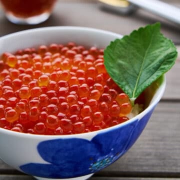 Ikura don with homemade ikura (salmon roe) on a hot bowl of rice.