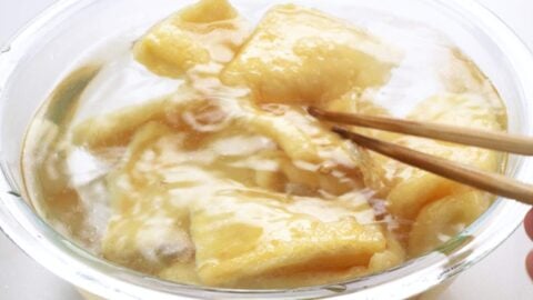 Washing tofu pockets in cold water.