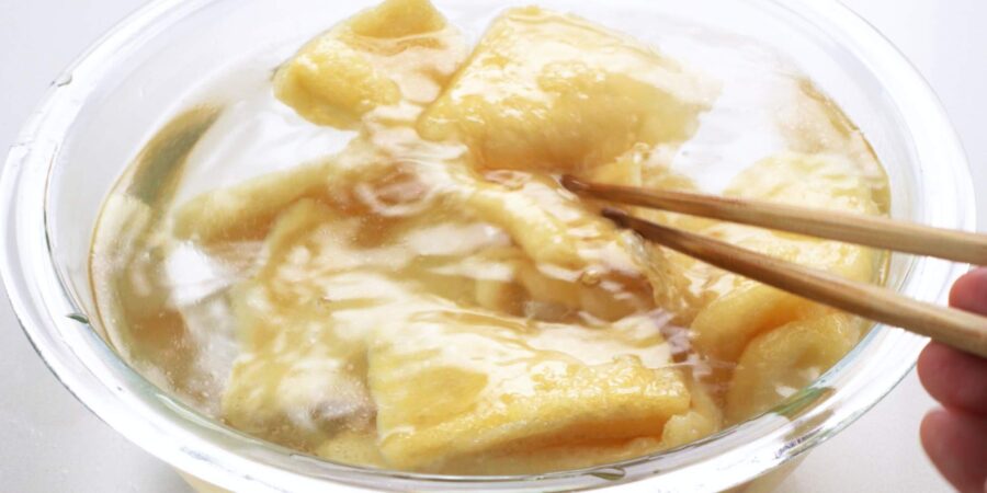 Washing tofu pockets in cold water.