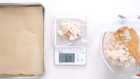 Weighing rice for inari sushi out into portions.