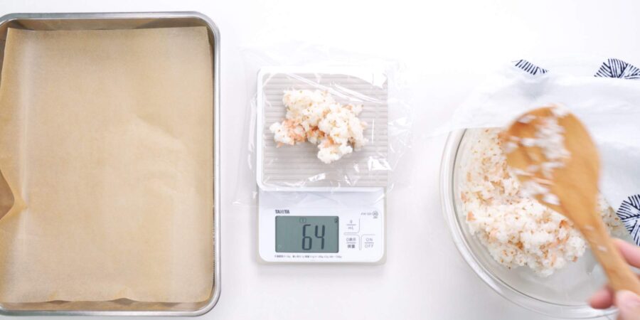 Weighing rice for inari sushi out into portions.