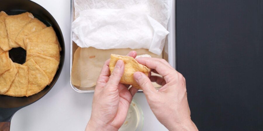 Wrapping sushi rice in inari tofu pockets.