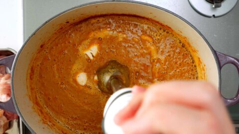 Pureeing the caramelized aromatics with a banana and stock to make the base for Japanese Curry.