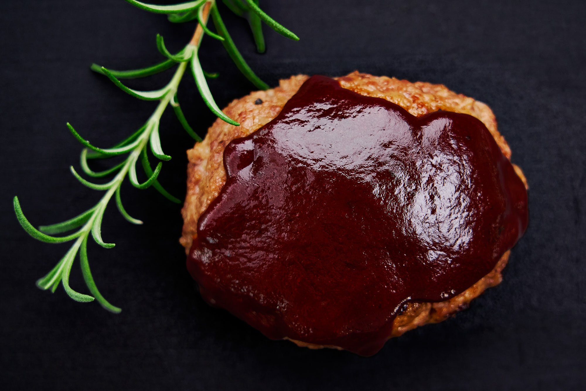 Overhead view of a Japanese hamburger steak glazed with a simple hamburg steak sauce.