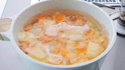 Boil potatoes and carrots.