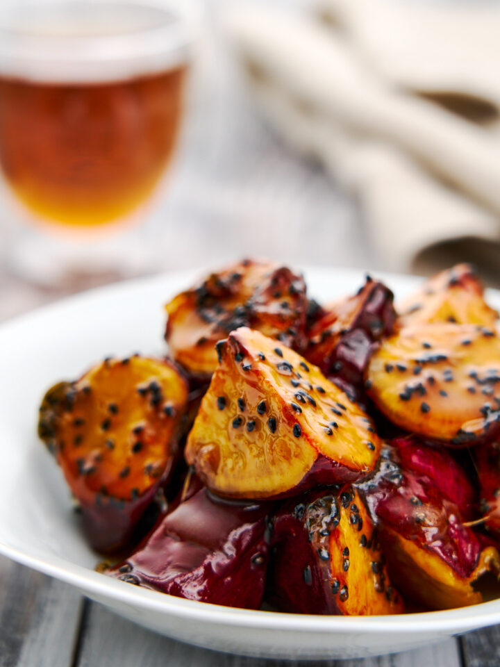 Tender, fluffy Japanese sweet potatoes glazed in a crisp sesame candy shell, Daigaku Imo is an irresistible Japanese street food snack.