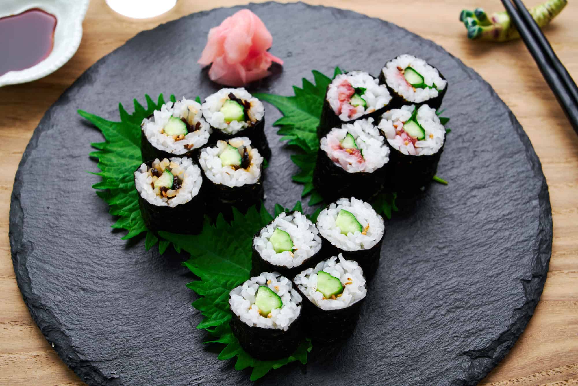 Detailed cross-section view of three variations of cucumber sushi roll or Kappa Maki, highlighting the balance of ingredients.