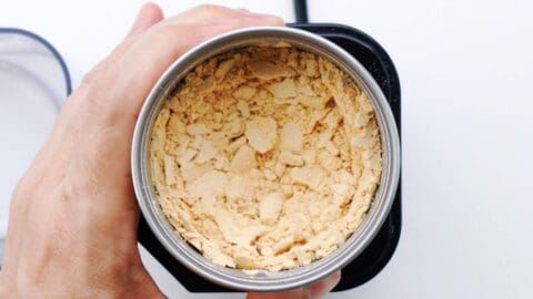 Grinding roasted soybeans into Kinako powder.