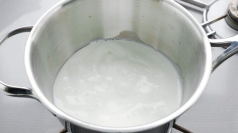 Heating milk in a pot.