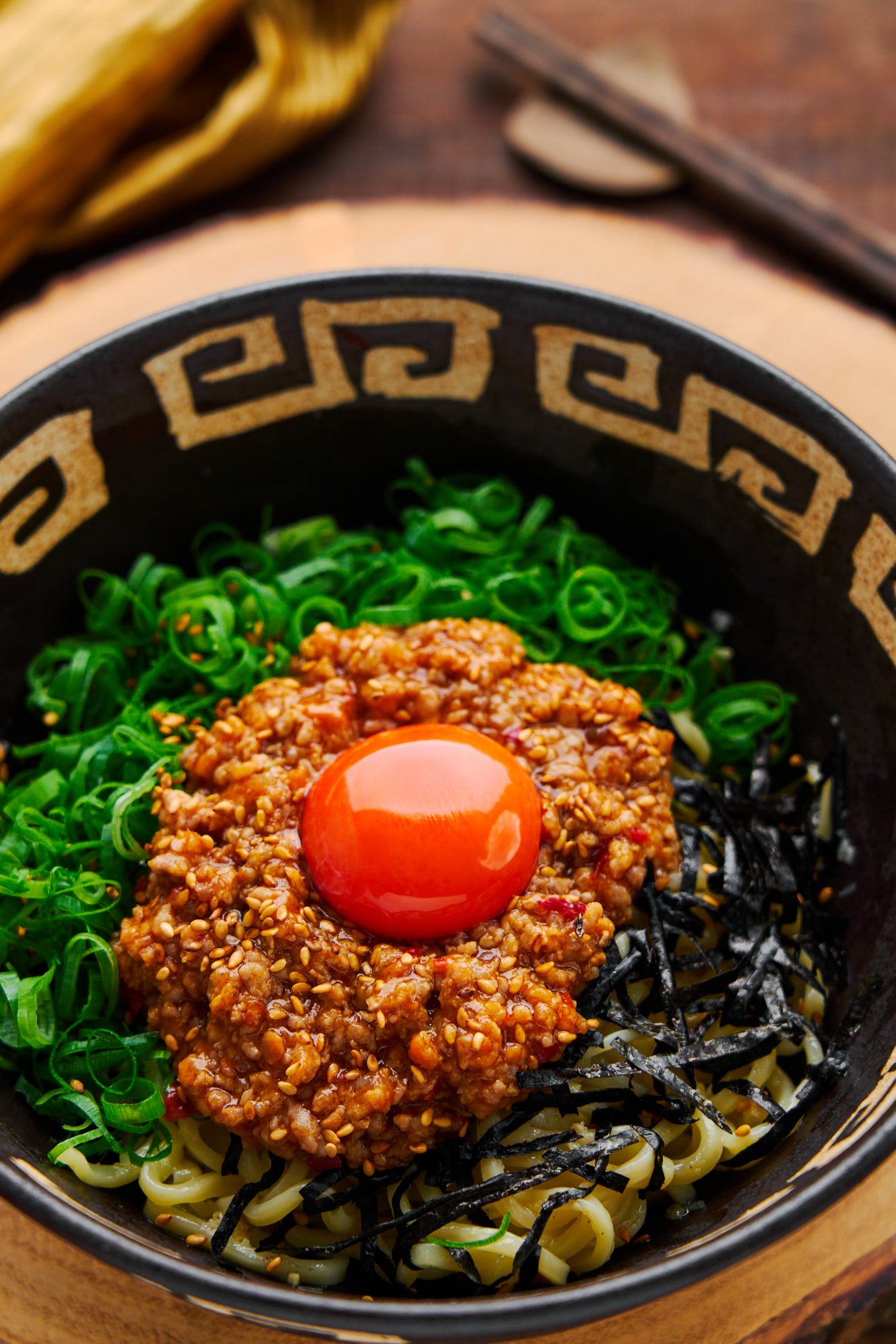 Easy and flavorful mixed ramen noodles (mazemen) topped with spicy pork, scallions, nori and egg yolk.
