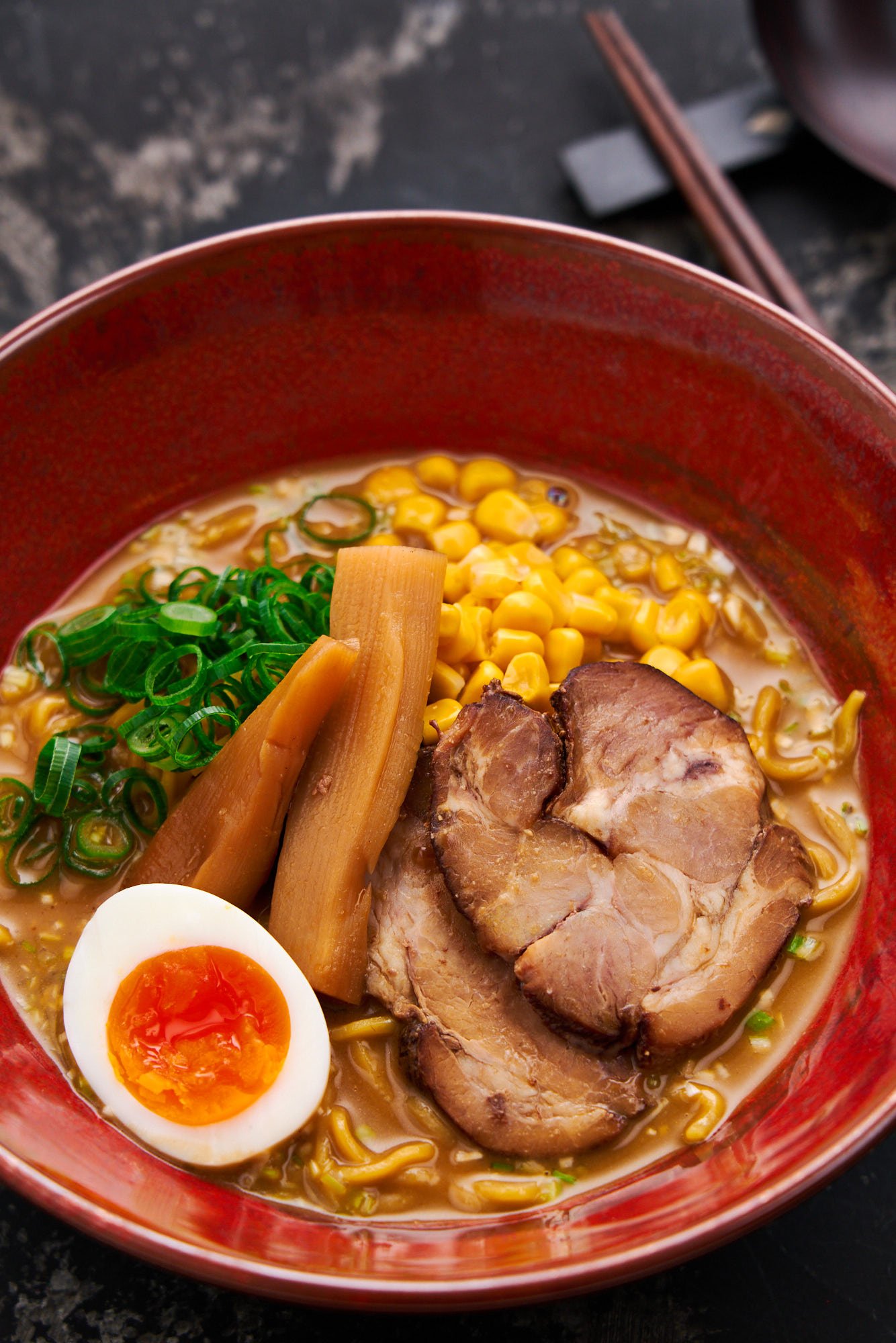 30 minutes is all it takes to make this rich bowl of Sapporo-style miso ramen. With creamy broth, tender chashu pork, green onions, bamboo shoots, sweet corn, and a perfectly cooked ajitama egg.