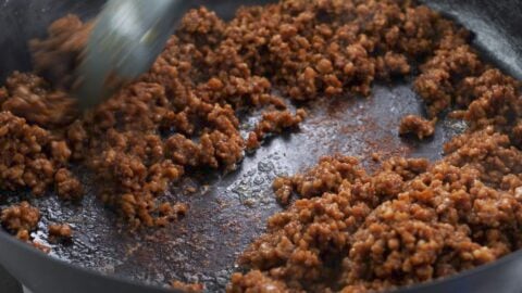 Browned pork and aromatics for ramen broth base.