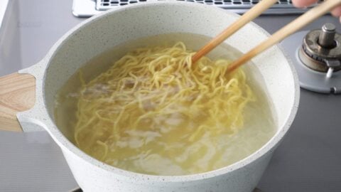 Boiling ramen noodles for Sapporo style ramen.