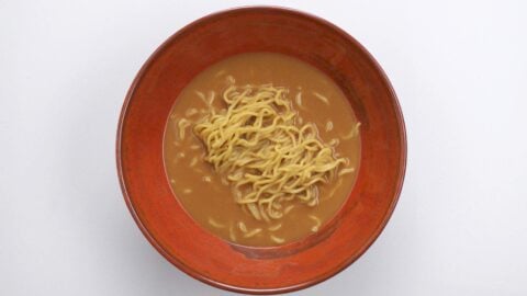 Ramen noodles in bowl with miso ramen broth.