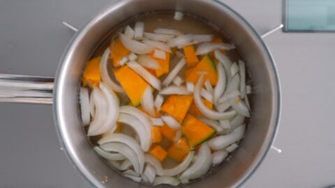 Onions and kabocha pumpkin simmering in Dashi for making miso soup.