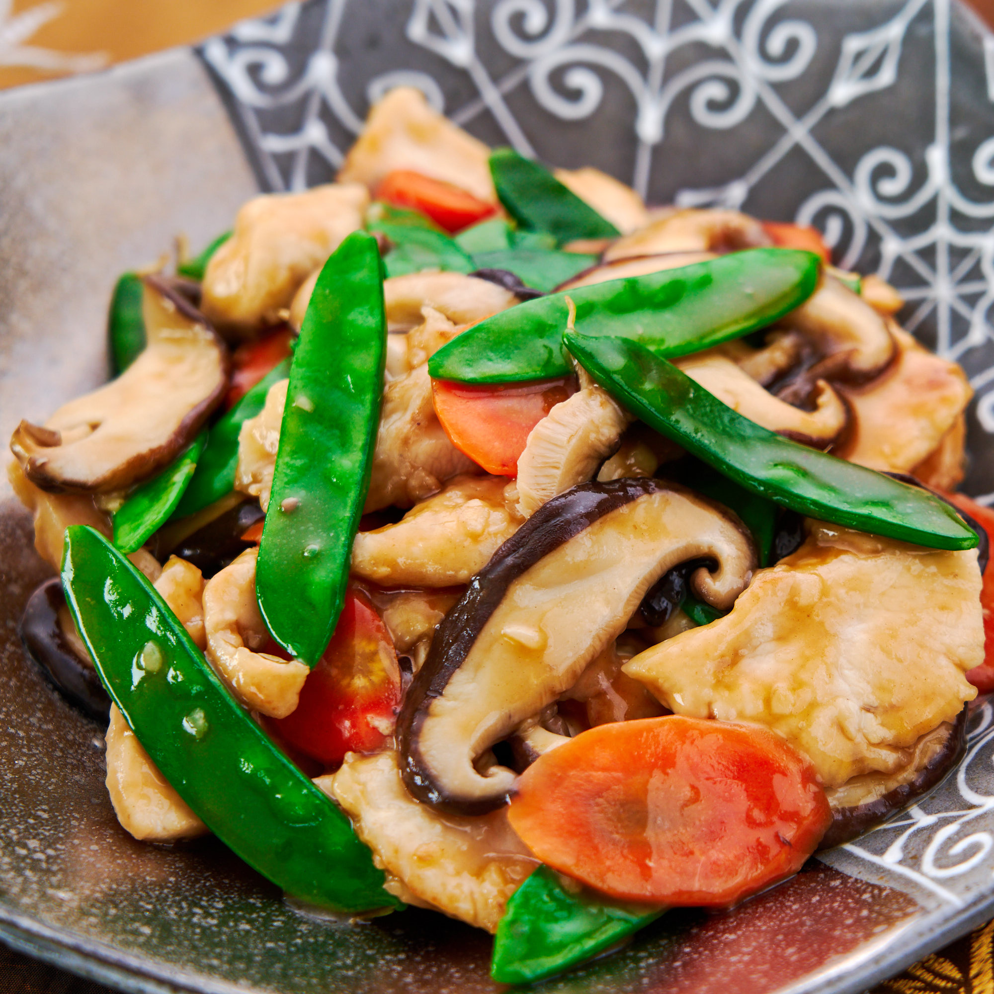 A 15 minute stir-fry made with chicken, mushrooms, carrots and sugar peas.