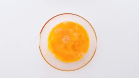 Lightly beaten egg for oyako donburi.