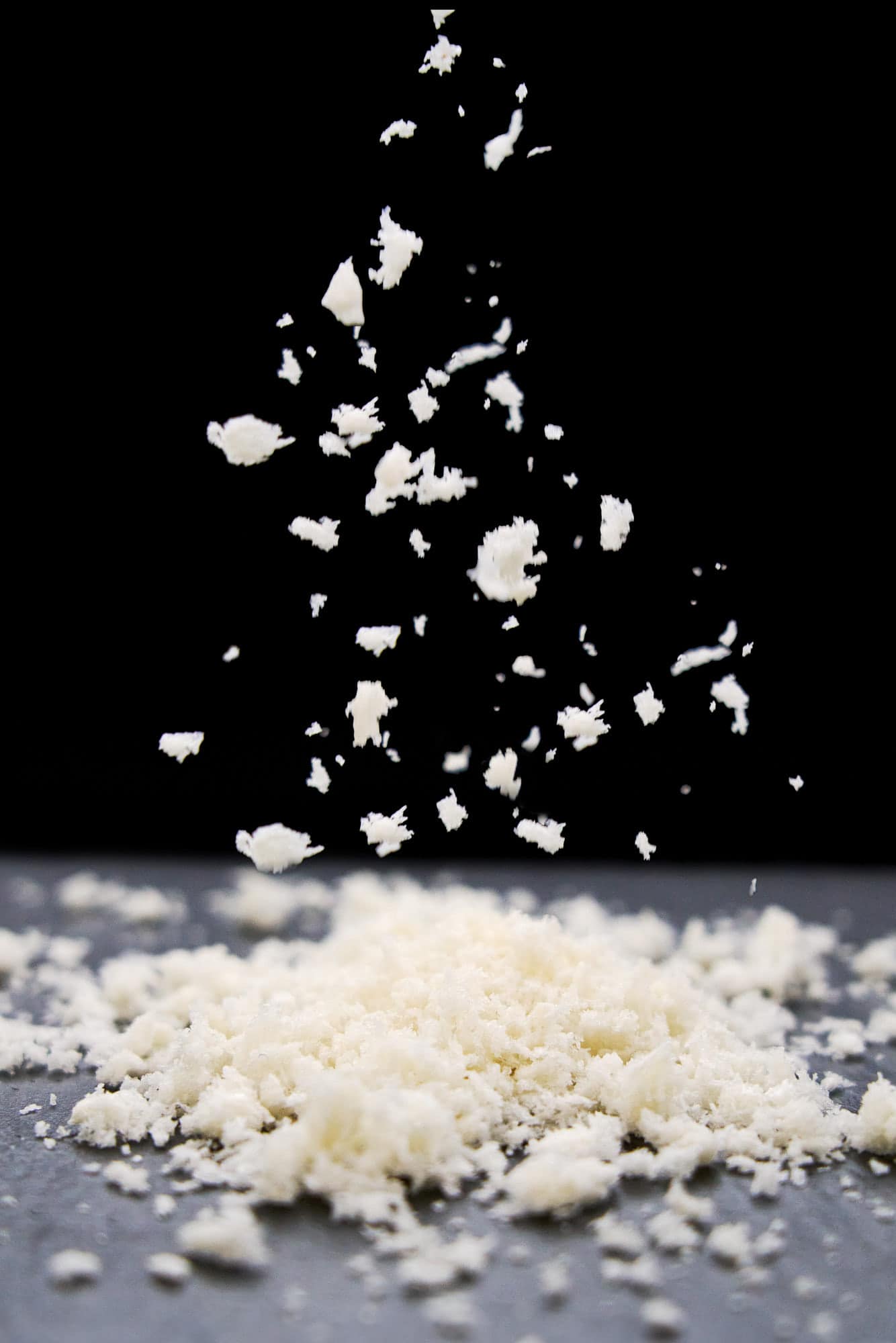 Sprinkling fresh Japanese panko bread crumbs.