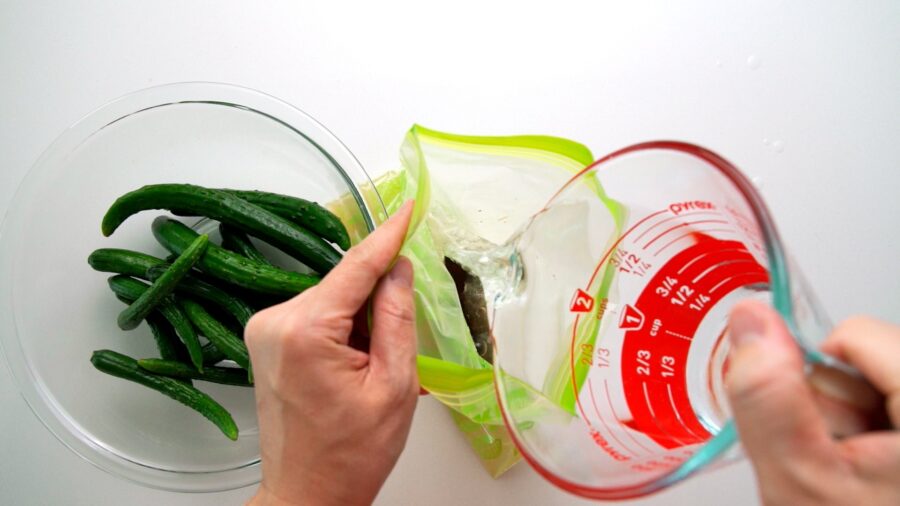 Making a salt brine to pickle Japanese cucumbers.