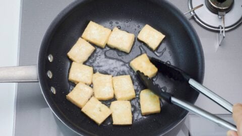 Pan-frying tofu.