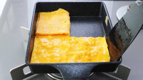Folding egg omelettes in half.
