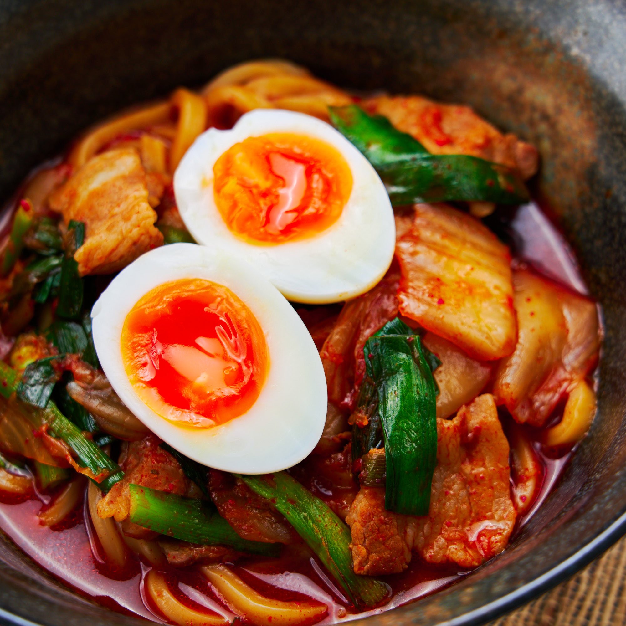 Spicy Kimchi Noodles with pork and a soft boiled egg.