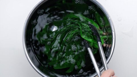 Chilling spinach in an ice bath.