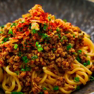 These easy spicy sesame ramen noodles are topped with an umami-bomb ground meat stir-fry.