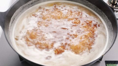 Simmering ramen soup base.