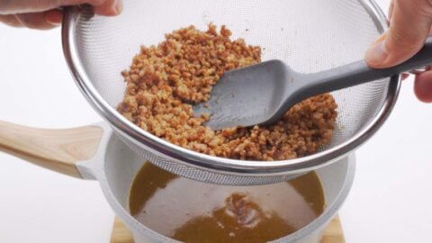 Straining tsukemen broth.