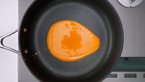 Beaten egg in pan for making Usuyaki Tamago.