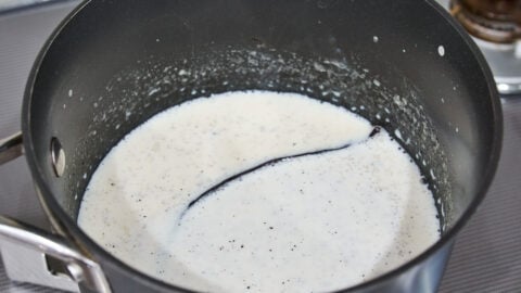 Steeping vanilla beans in the soymilk mixture.