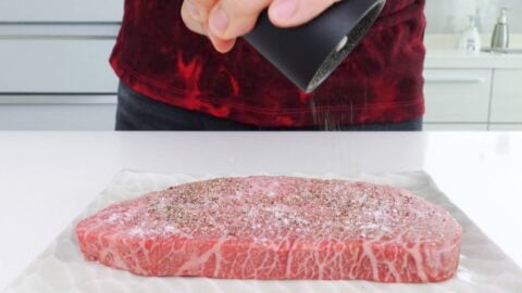 Seasoning A5 Wagyu Steak with salt and pepper.