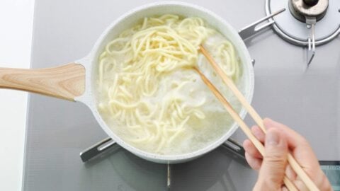 Boiling a pot of ramen noodles for yakisoba.