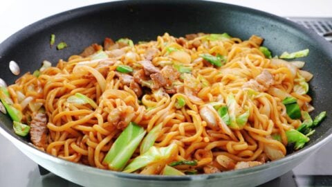 Yakisoba noodles in a frying pan.